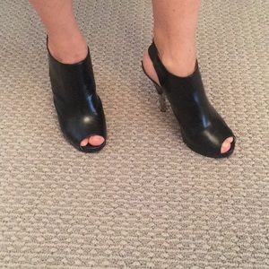 KORS, size 7.5, black leather with silver heel.